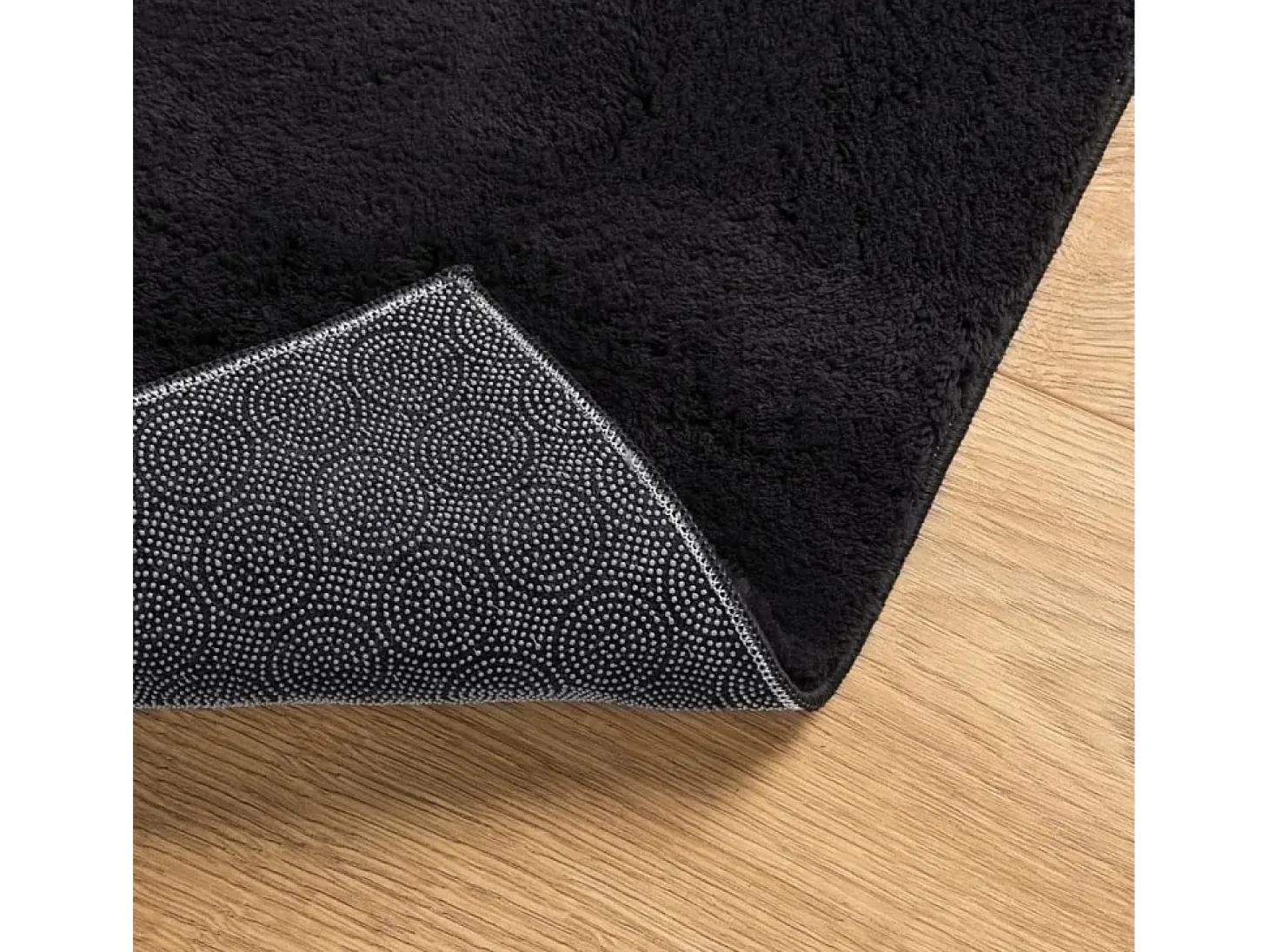 Alfombra HUARTE de pelo corto suave y lavable negra 100x200 cm