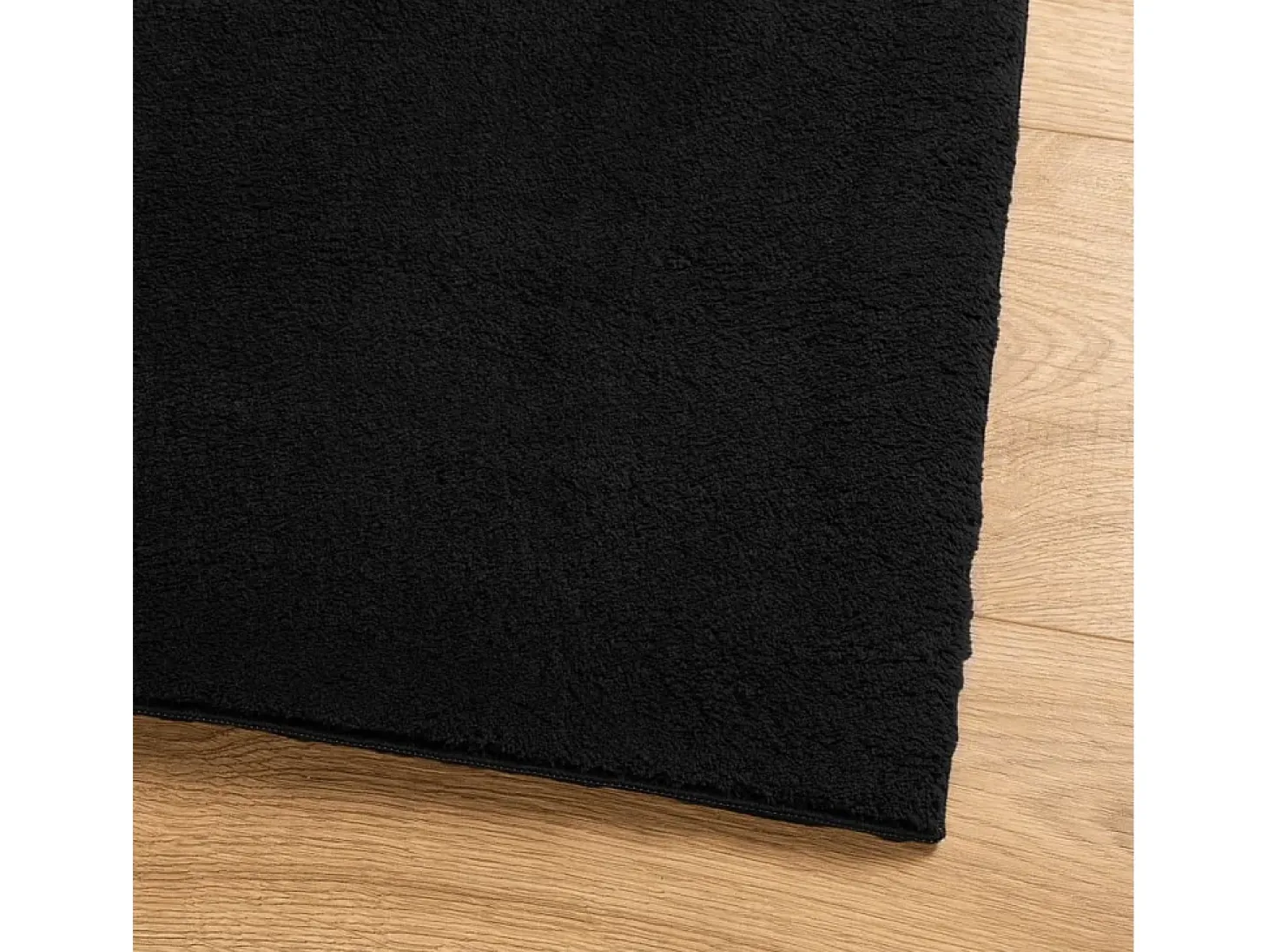 Alfombra HUARTE de pelo corto suave y lavable negra 200x280 cm