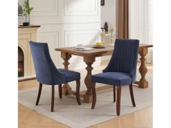 Conjunto de 2 sillas azules con patas de madera curvadas y respaldo alto.