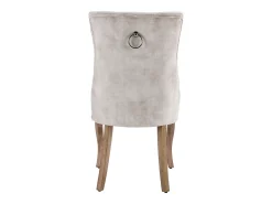 Conjunto de 6 sillas de terciopelo beige claro con patas de madera curvadas y botones decorativos.