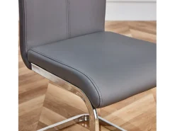 Juego de 4 sillas cantilever de PU gris con estructura de metal plateado