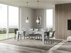 Mesa de comedor extensible de madera Naxo.-Color Gris cemento-Soporte 4 pies-5 alargaderas finas-Ancho extensible