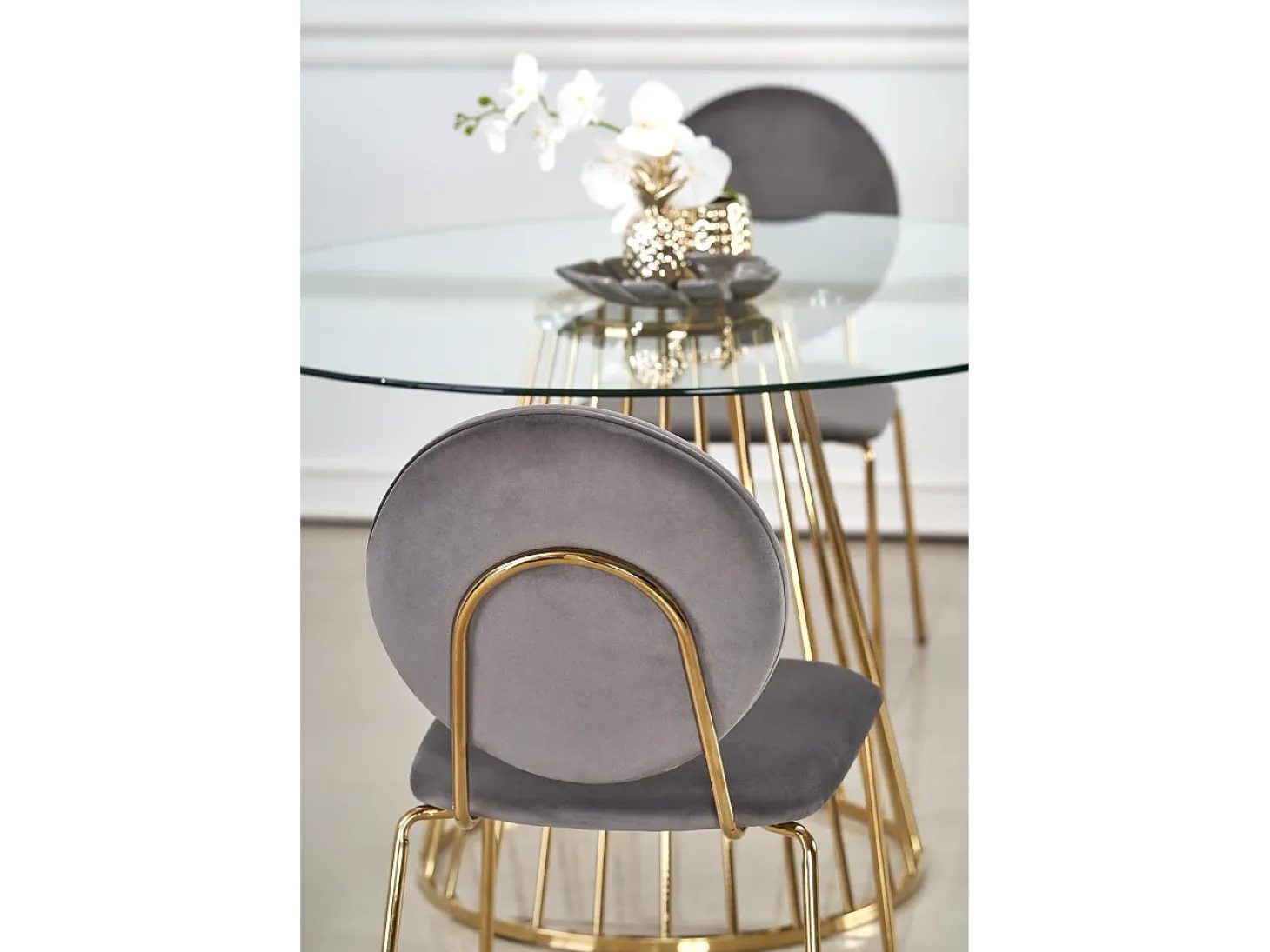 Mesa de comedor redonda con tapa de cristal y pata central de acero dorado Cambridge