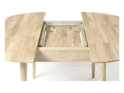 Mesa de comedor redonda extensible de 100 a 130 cm en roble macizo blanqueado Kundy
