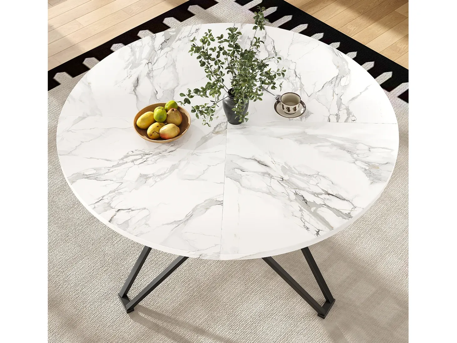 Mesa de comedor redonda 100x100x76cm con tablero chapado en mármol blanco, estructura regulable de metal negro.