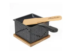 Raclette individual a la luz de las velas