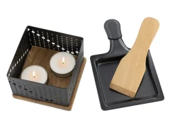 Raclette individual a la luz de las velas