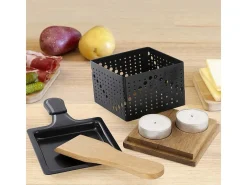 Raclette individual a la luz de las velas
